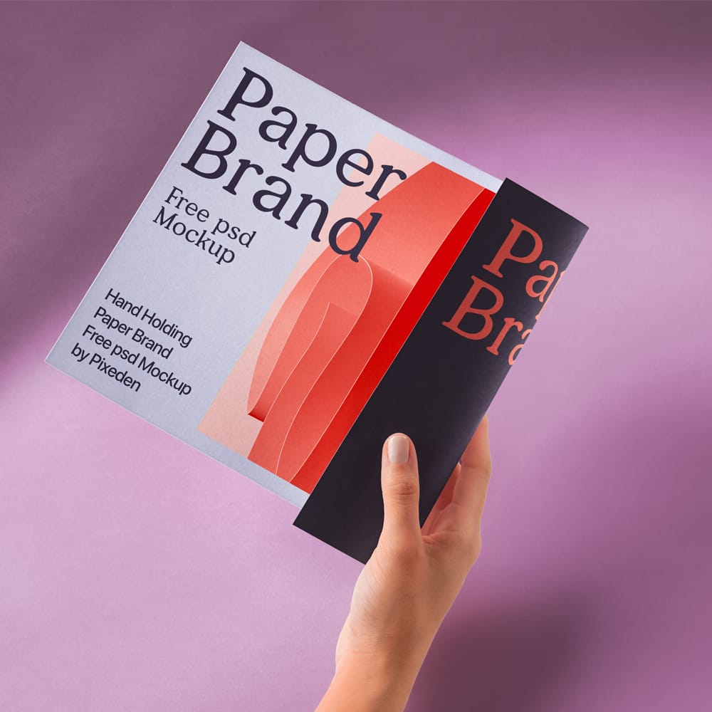 Free Hand Holding Paper Brand Mockup PSD