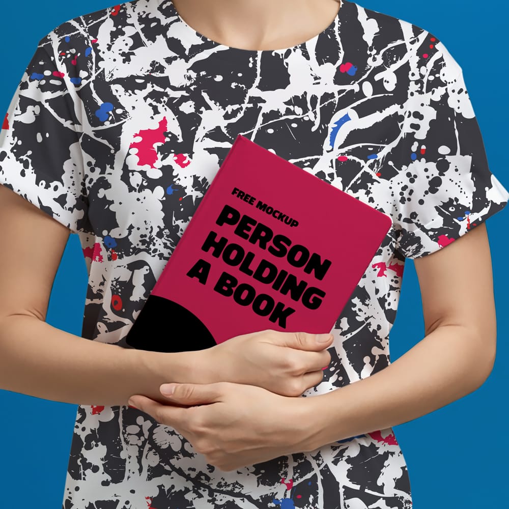 Free Mockup of a Person Holding a Book PSD