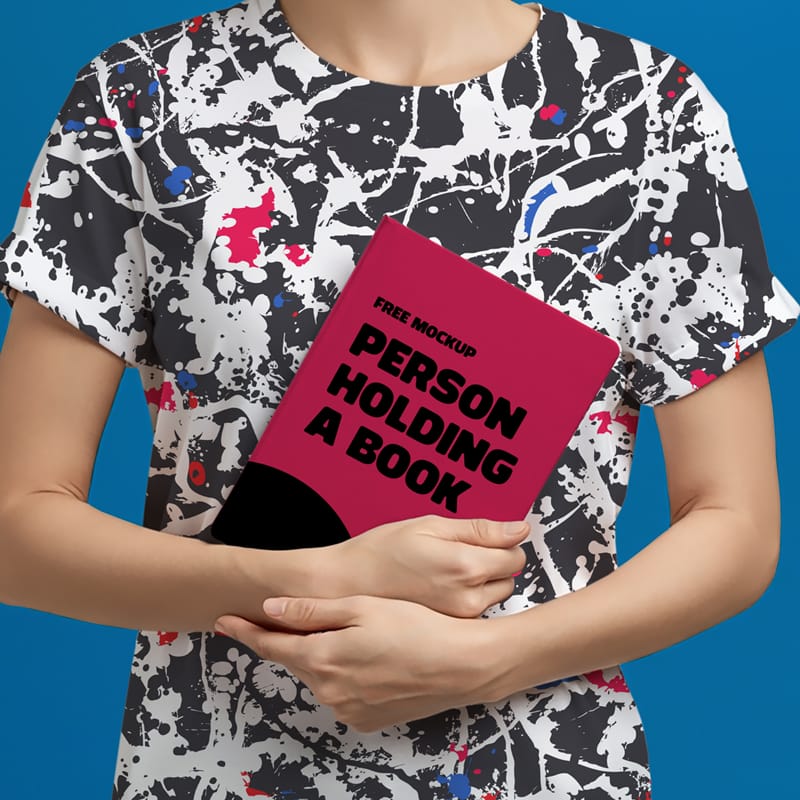 Mockup of a Person Holding a Book PSD