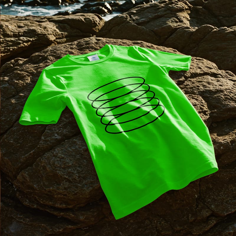 T-shirt Mockup on a Seaside Rock PSD