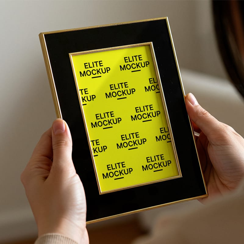 Woman Holding a Portrait Frame Mockup