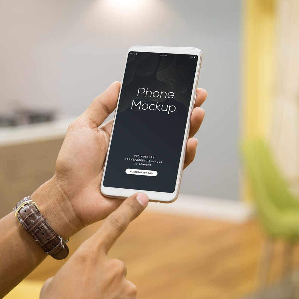 Free Phone in Men's Hand Mockup PSD