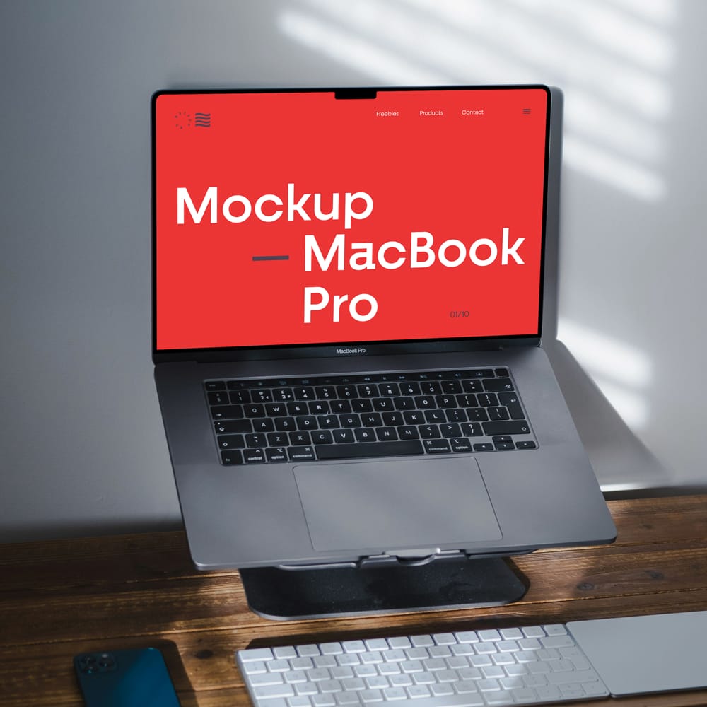 Free MacBook Pro on Stand Mockup PSD