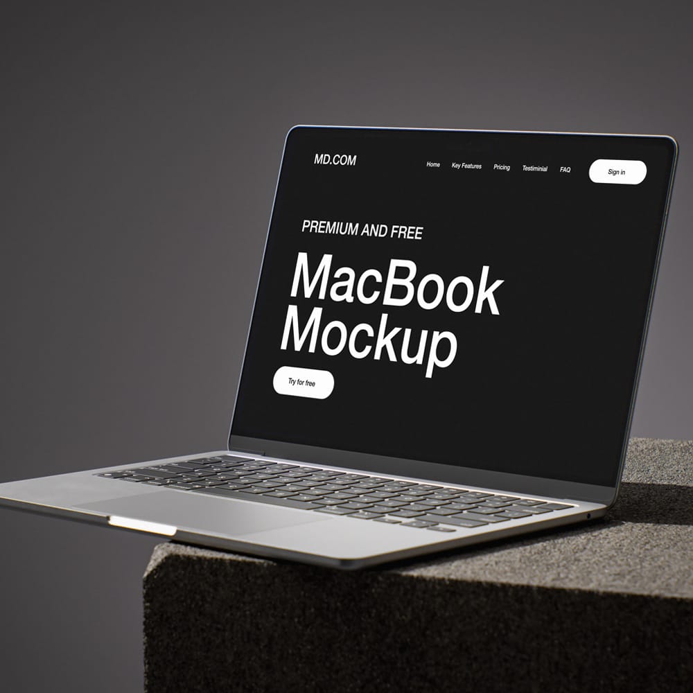 Free MacBook on Concrete Cube Mockup PSD