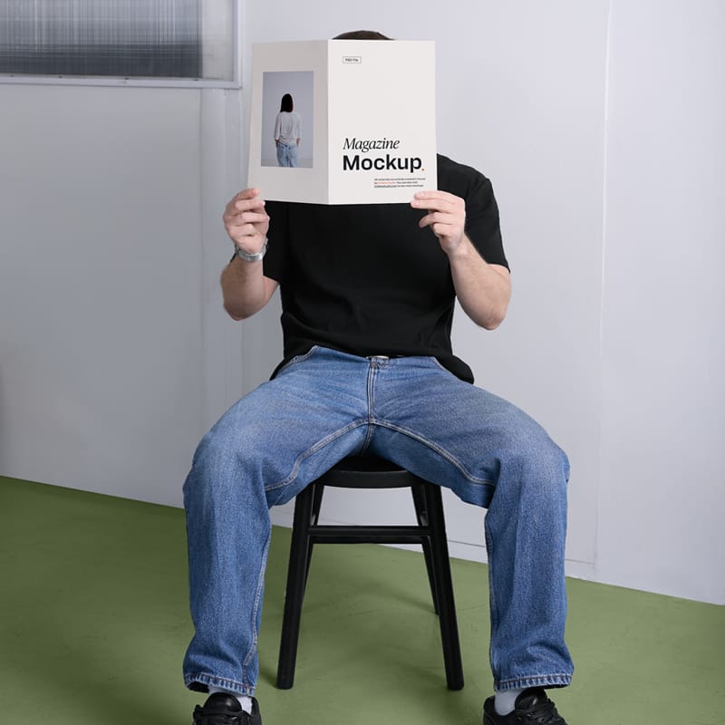 Person Holding Magazine Mockup PSD