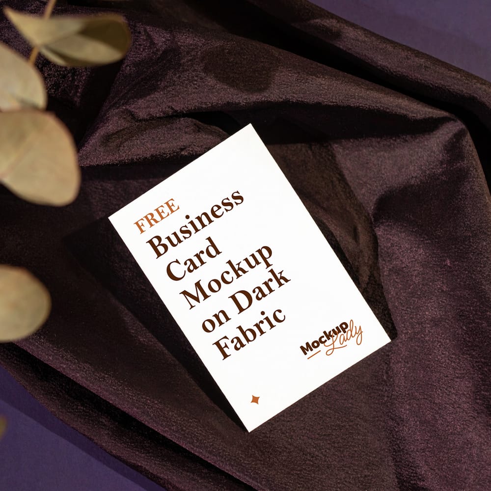 Free Business Card Mockup on Dark Fabric PSD