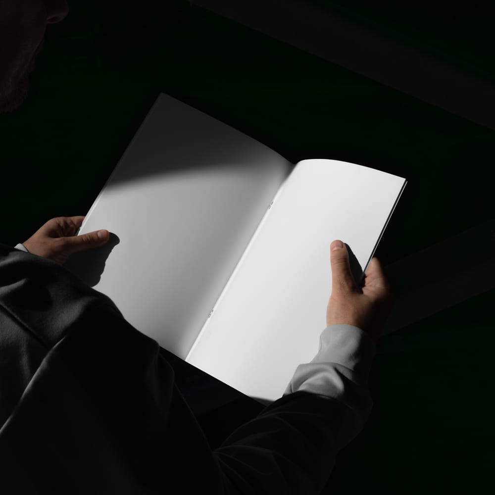 Free Hand Held Brochure Mockup PSD