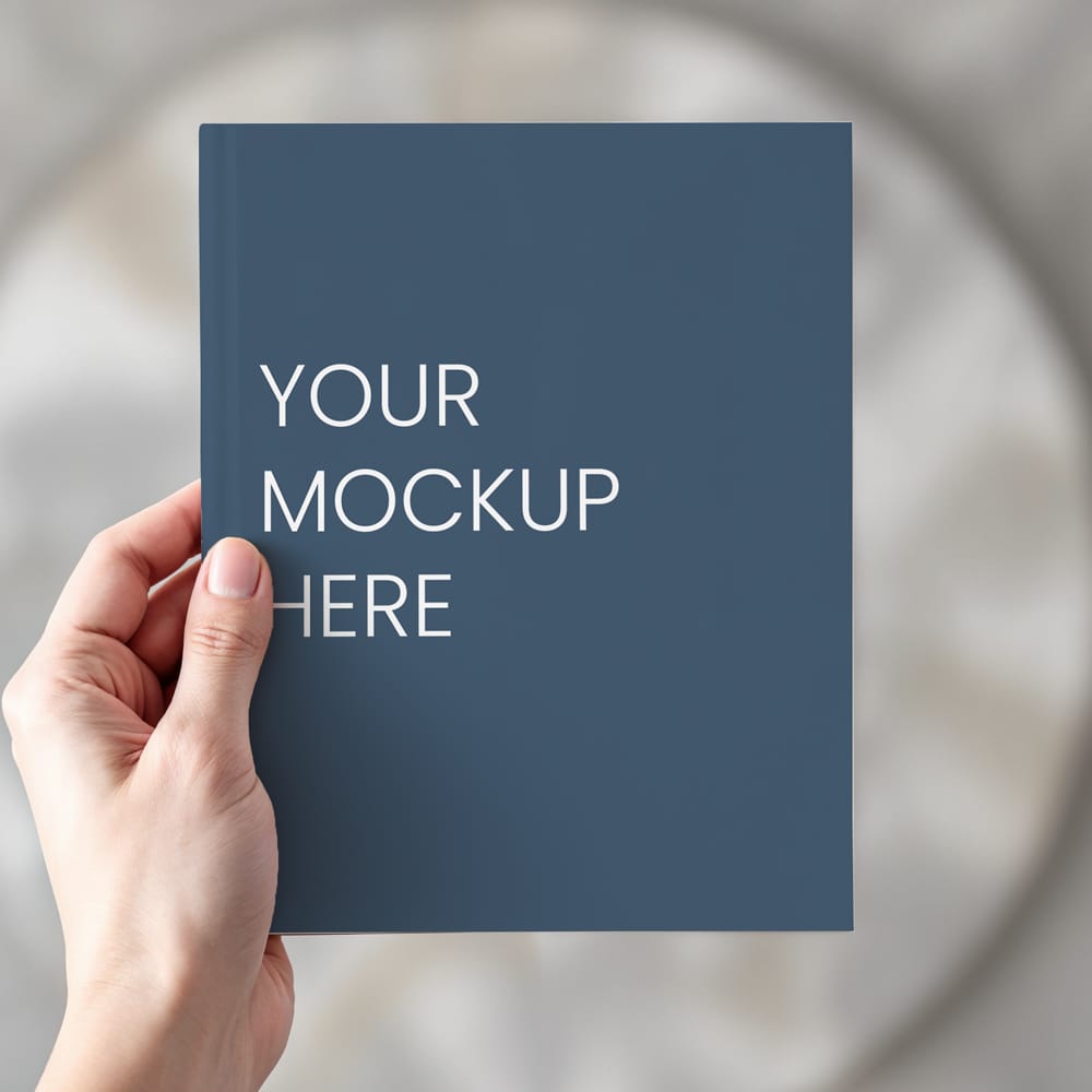 Free Paperback Book in Hand Mockup PSD