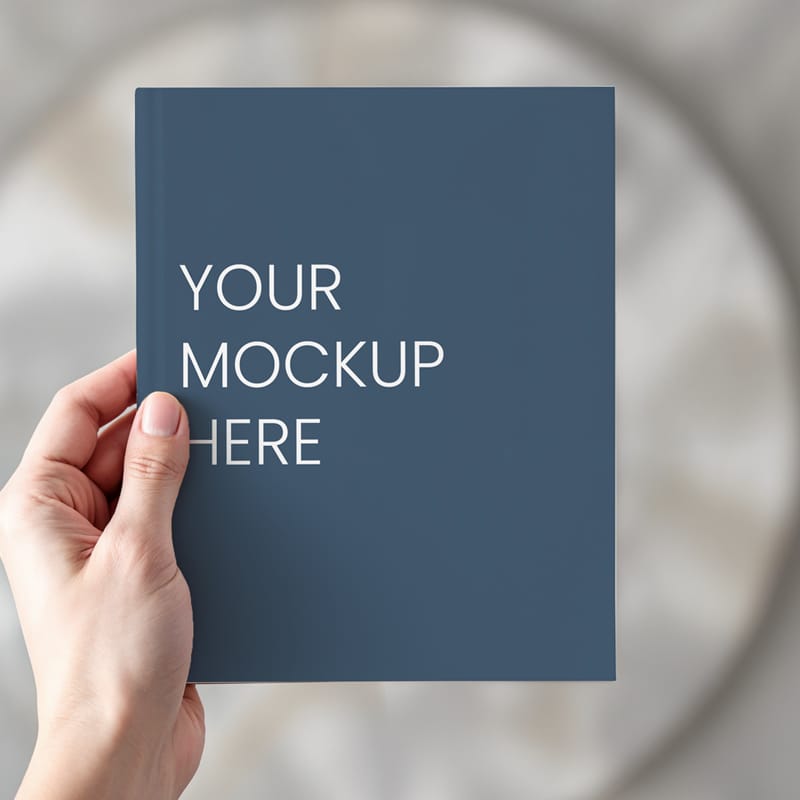 Paperback Book in Hand Mockup PSD