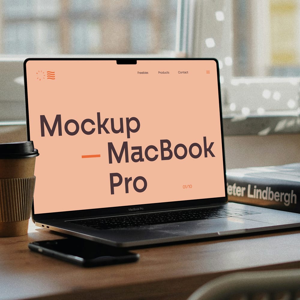 Free MacBook Pro on Writing Desk Mockup PSD