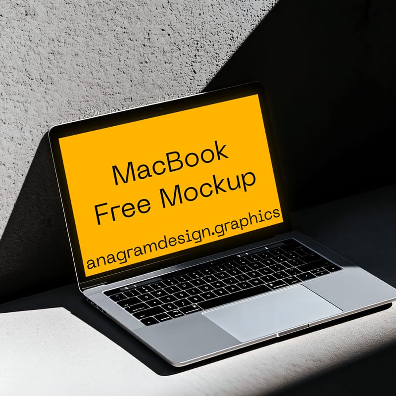MacBook Mockup on a Concret Wall PSD