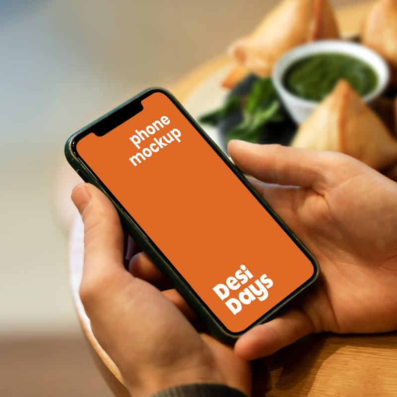 Man with Phone Mockup and Snacks PSD