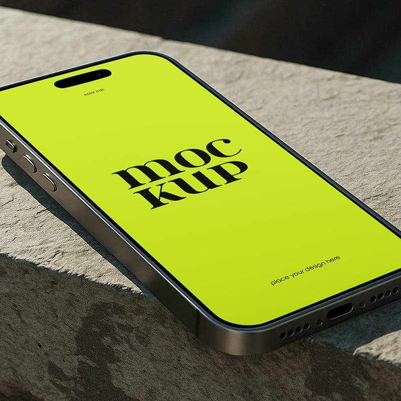 Realistic iPhone on Rock Mockup PSD