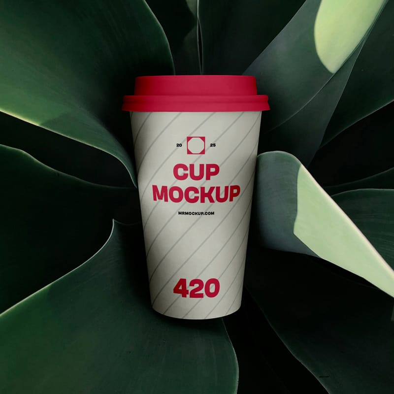Coffee Cup Surrounded by Plant Mockup PSD