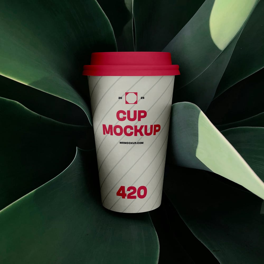 Free Coffee Cup Surrounded by Plant Mockup PSD