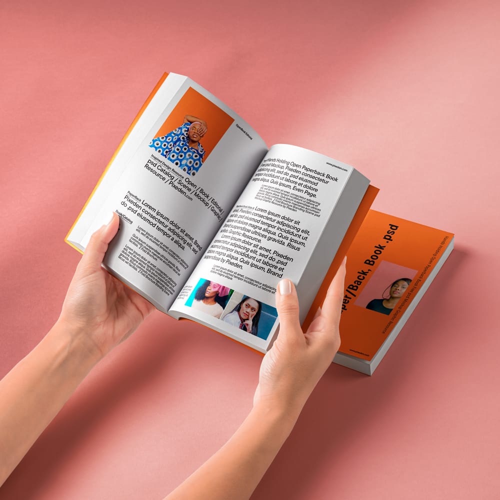 Free Hands Holding Open Paperback Book Mockup PSD