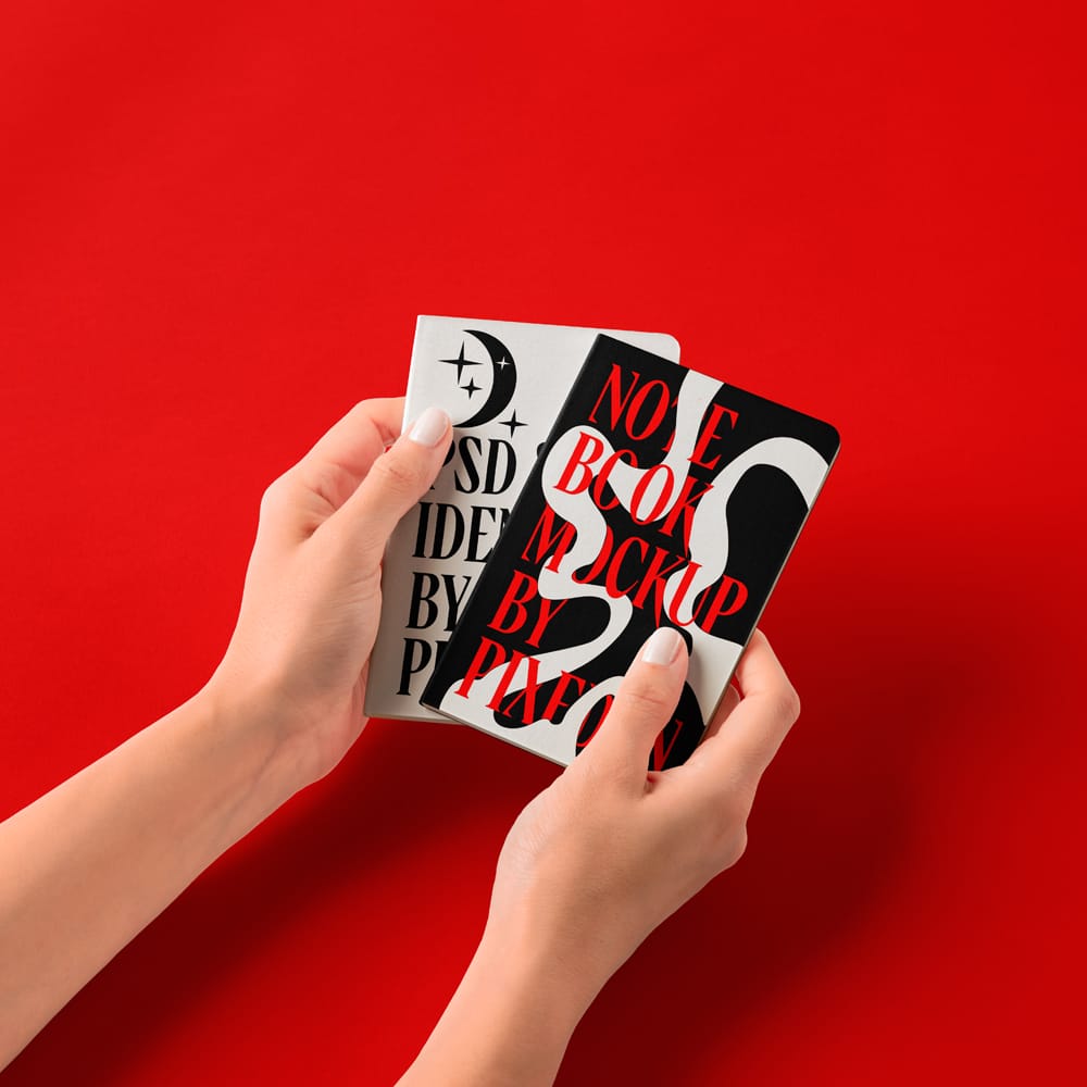 Free Hands Holding Pocket Classic Notebooks Mockup PSD