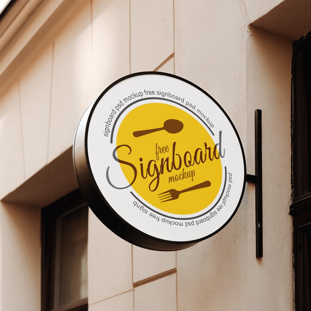 Free Round Cafe Sign Mockup on European Coffee Shop Facade PSD