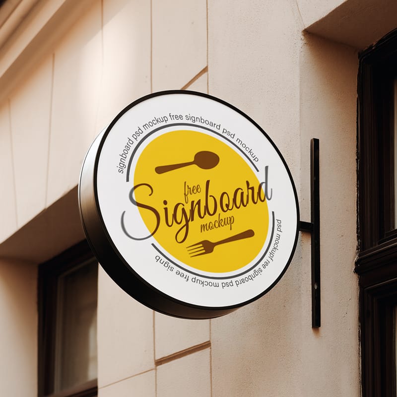 Round Cafe Sign Mockup on European Coffee Shop Facade PSD