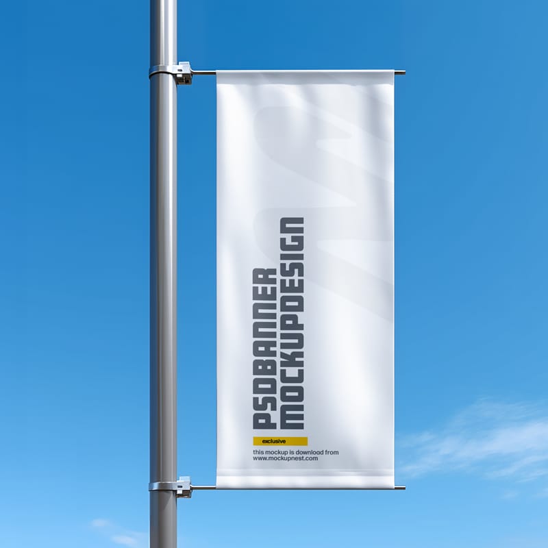 Vertical Street Banner Mockup on Pole in Clear Blue Sky PSD