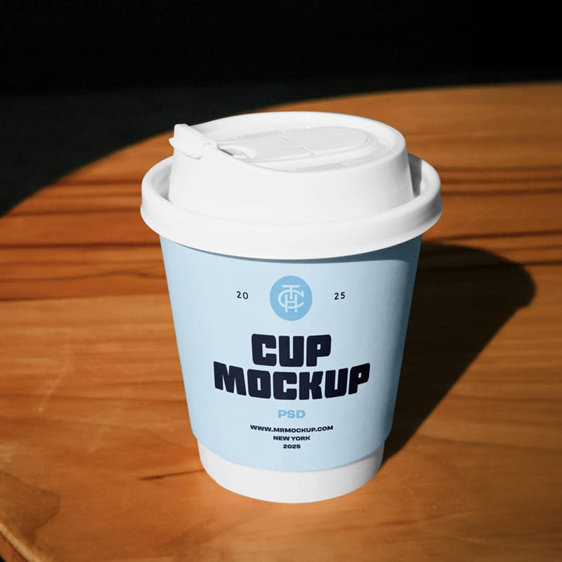 Coffee Cup on a Table Mockup PSD