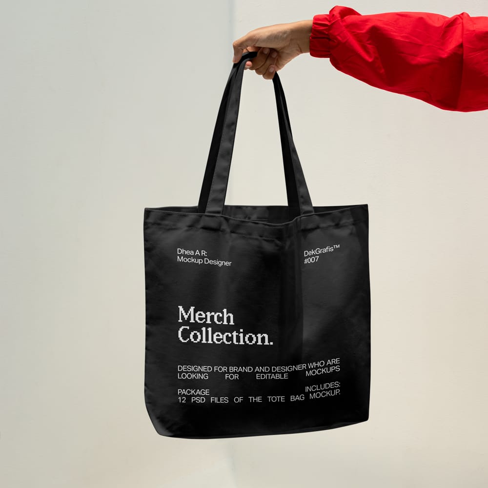 Free Hand Holding Canvas Tote Bag Mockup PSD