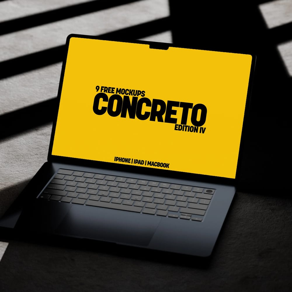 Free MacBook Air Mockup on Concrete Floor PSD
