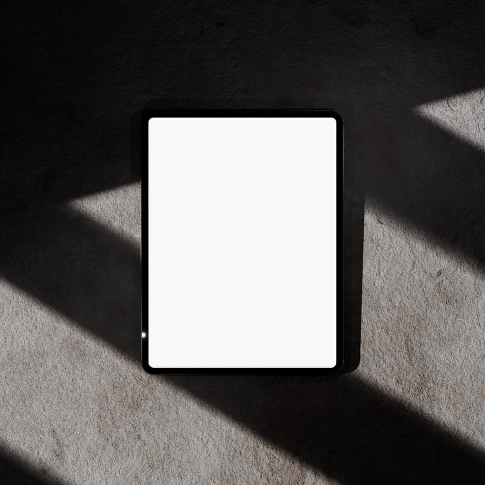 Free iPad Mockup on Minimal Concrete Floor PSD