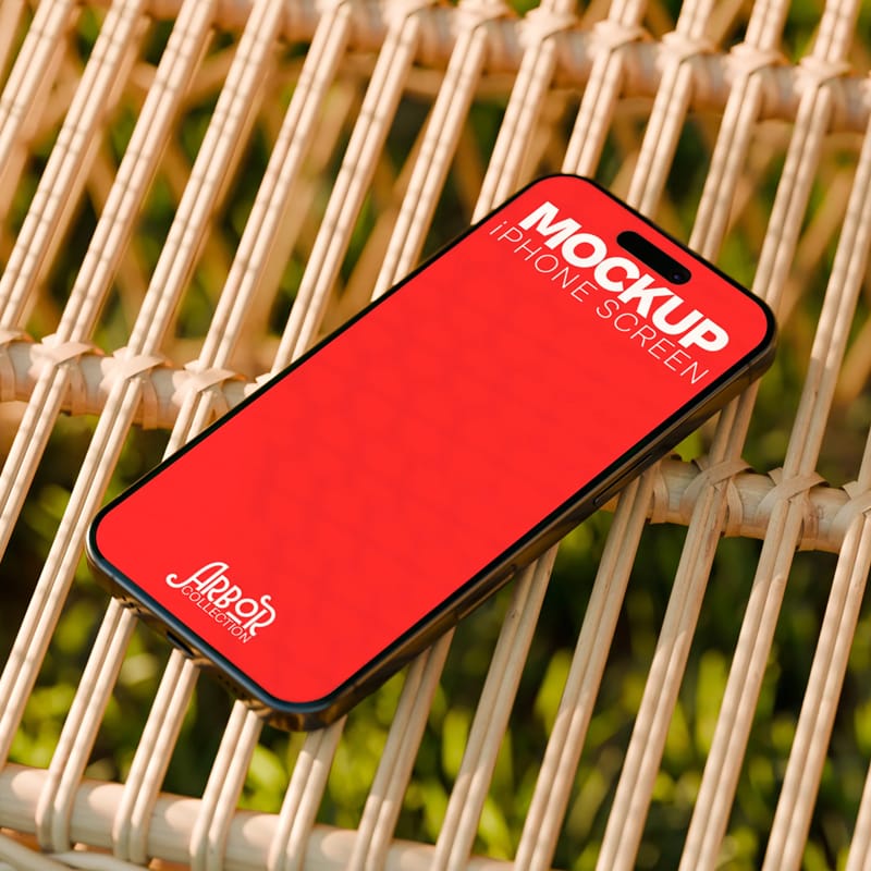 Outdoor iPhone Screen Mockup on Wicker Surface PSD