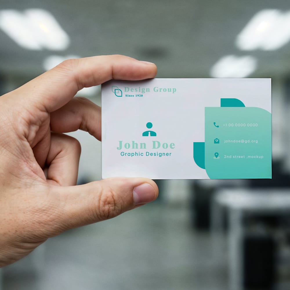 Free Business Card Held in Hand Mockup PSD