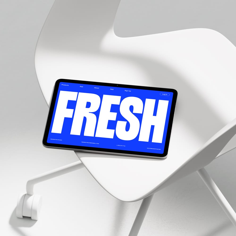 Free Tablet Mockup on Modern White Chair PSD