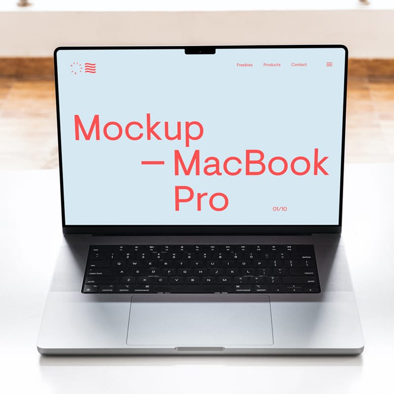 MacBook Pro on White Table Mockup PSD
