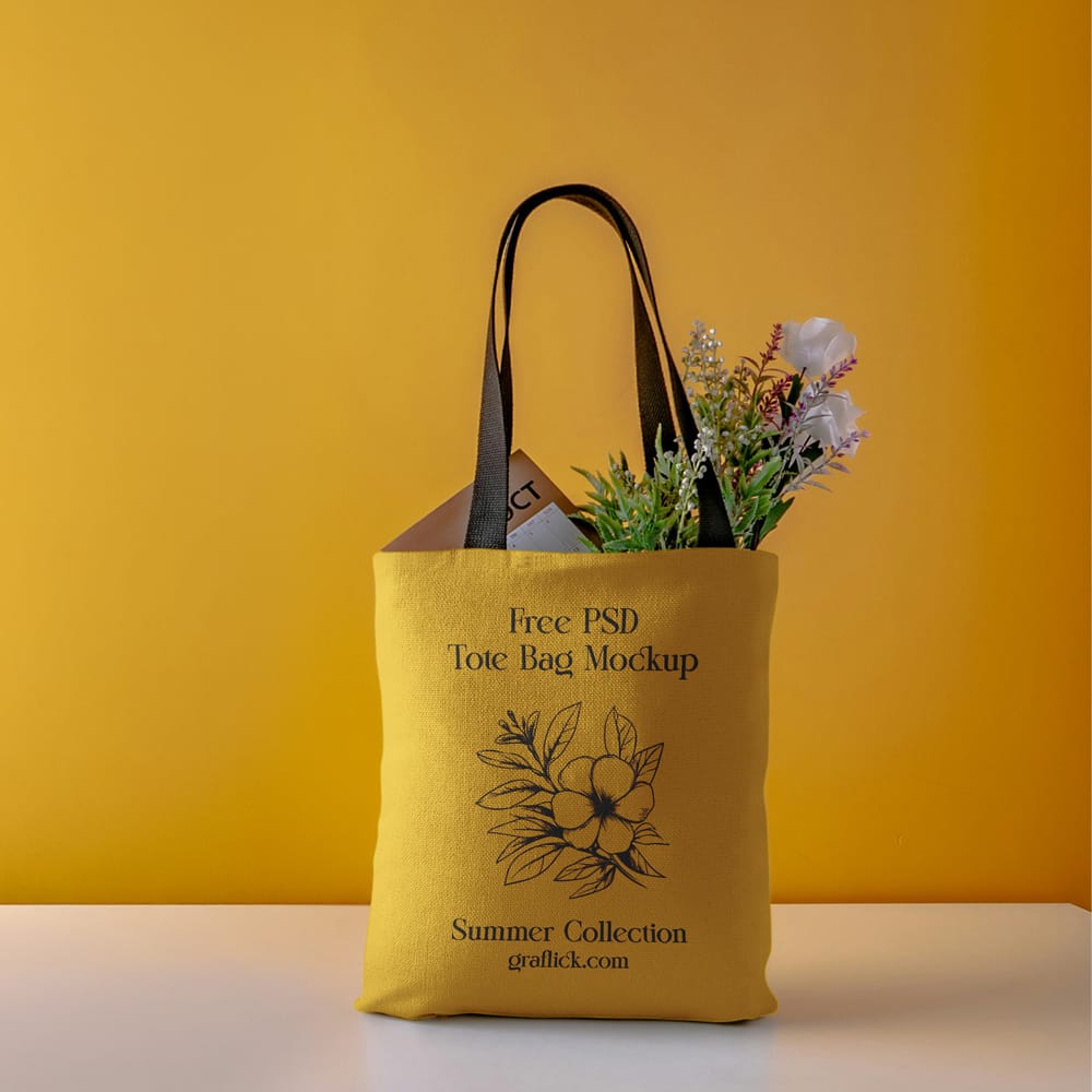 Free Canvas Tote Bag Mockup​ with Flowers PSD