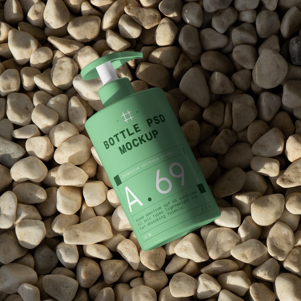 Free Cosmetic Bottle on the Beach Mockup PSD