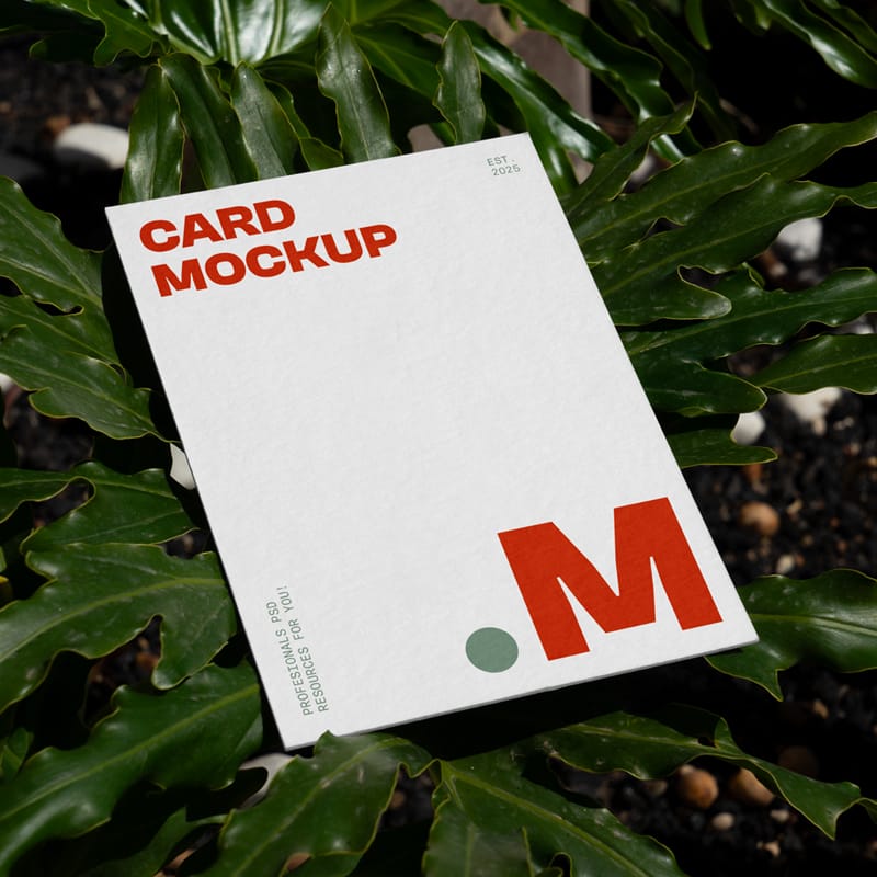 Laying Card Between Flowers Mockup PSD