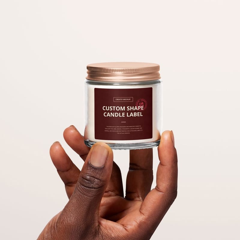 Clear Glass Candle Jar in Hand Label Branding Mockup PSD