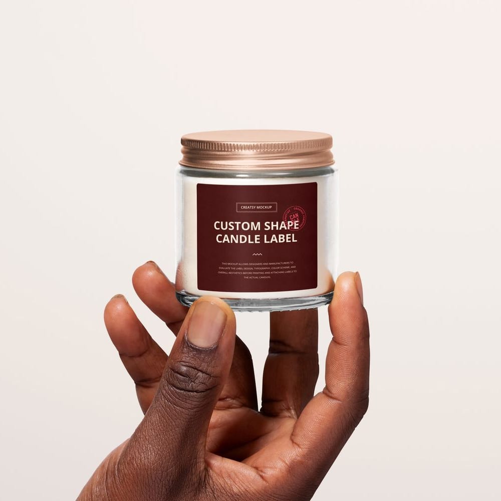 Free Clear Glass Candle Jar in Hand Label Branding Mockup PSD