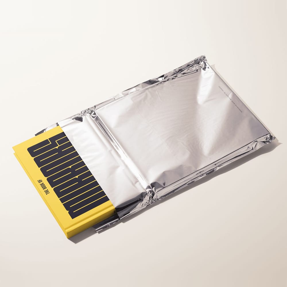 Free Hardcover Book in Metallic Foil Pouch Mockup PSD