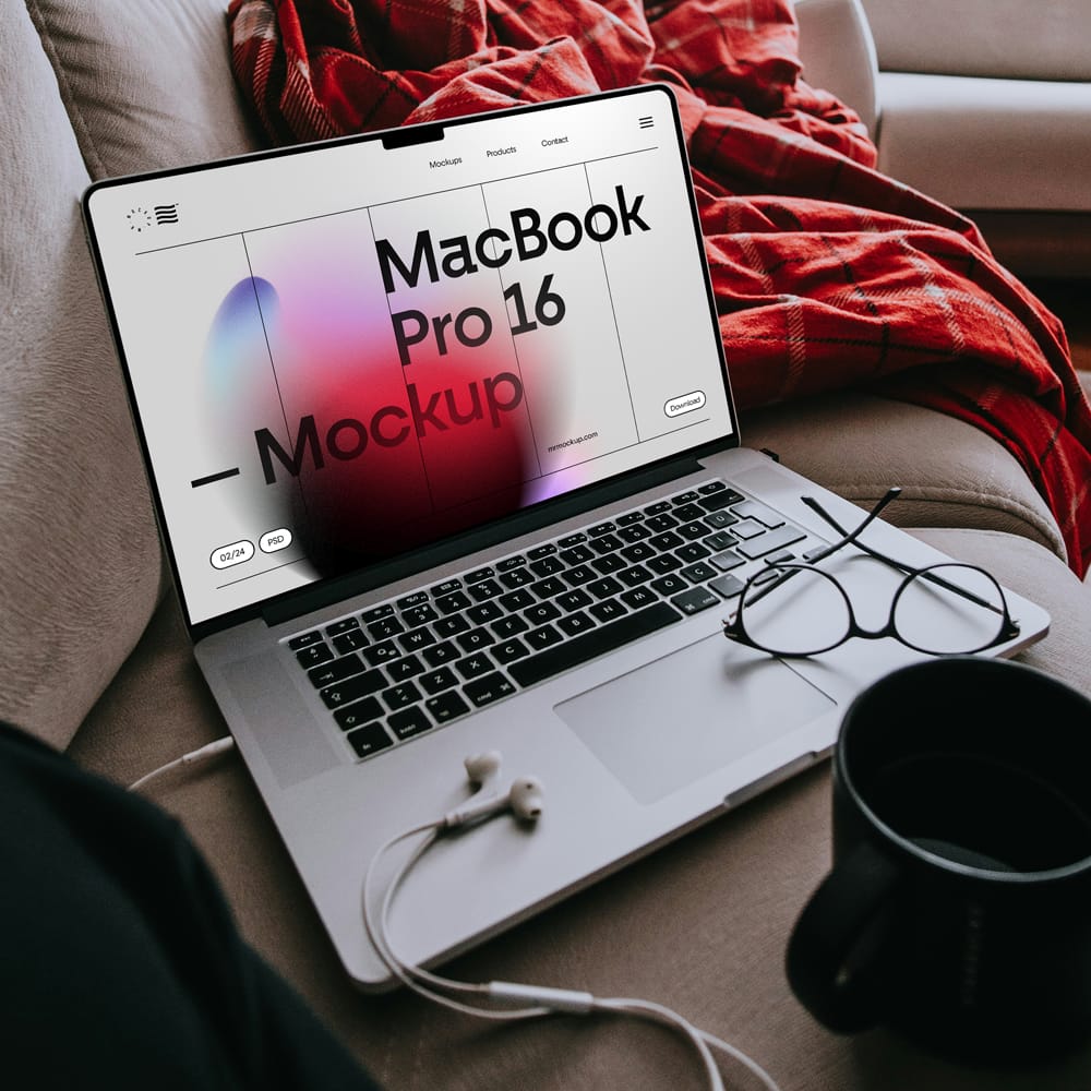 Free MacBook Pro Laying on Couch Mockup PSD