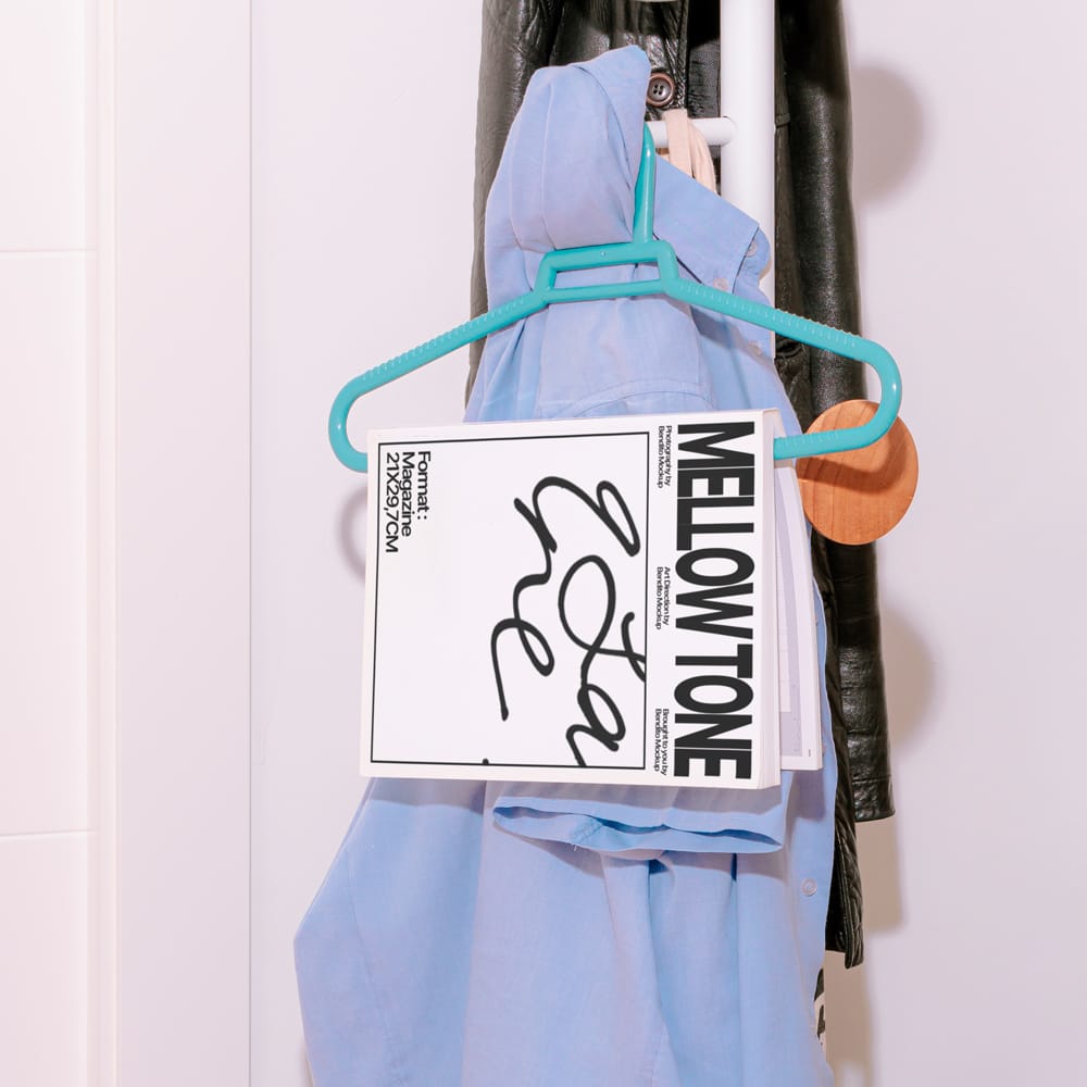 Free Realistic Magazine Mockup on Hanger with Apparel PSD