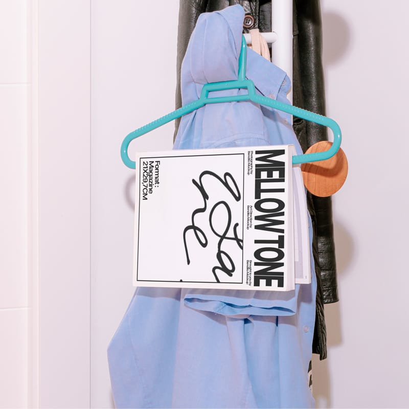 Realistic Magazine Mockup on Hanger with Apparel PSD