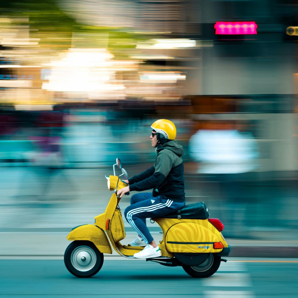 Free Scooter Driving Fast Mockup PSD