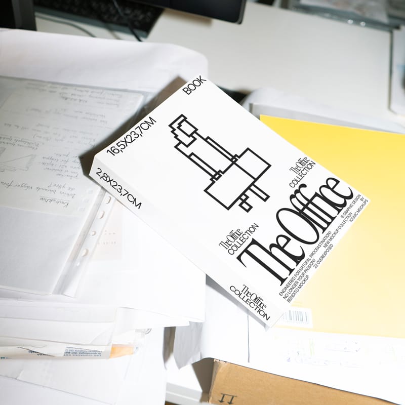 Realistic Book Cover Mockup on a Messy Office Desk PSD