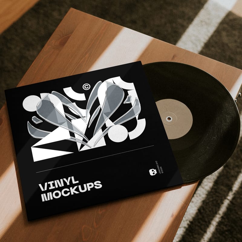 Lying Vinyl Pack on Wood Mockup PSD