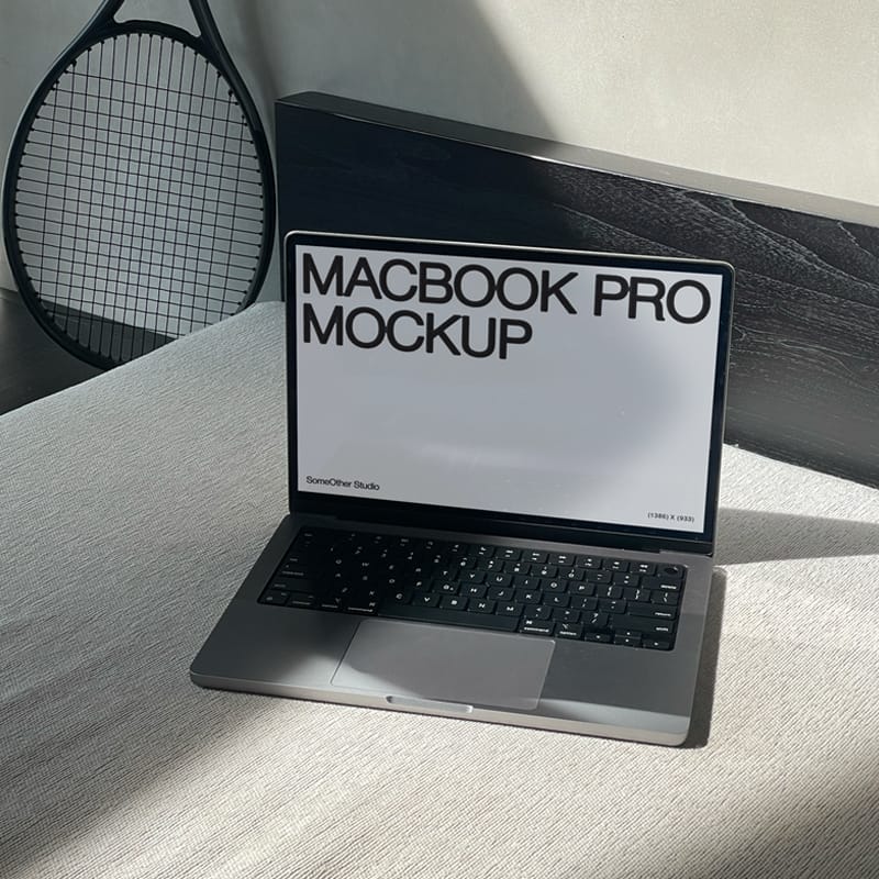 MacBook Laptop Mockup on Sofa with Natural Sunlight PSD