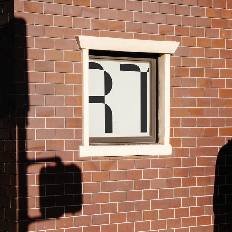 Realistic Urban Window Poster Mockup on Brick Wall PSD
