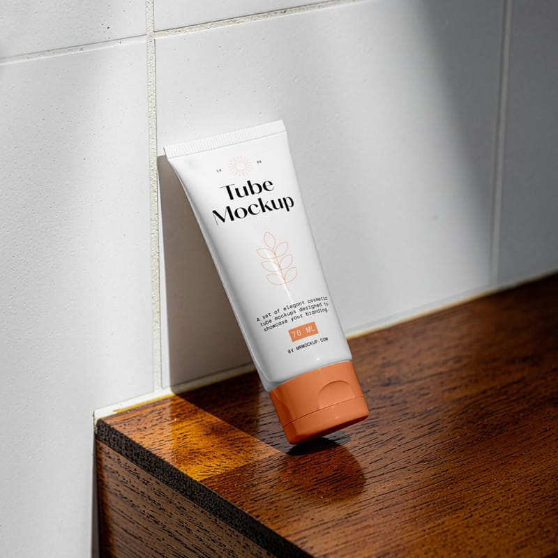 Cosmetic Tube Leans Against The Wall Mockup PSD
