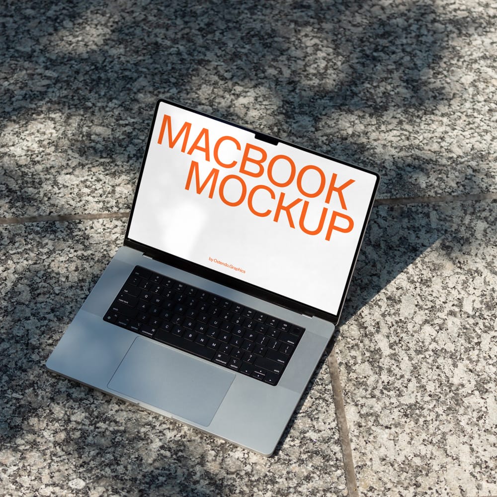 Free Macbook Pro Mockup on Stone Courtyard PSD