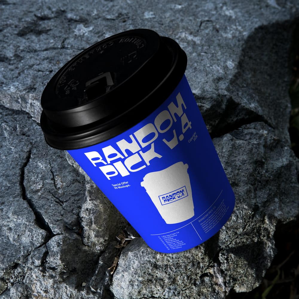 Free Coffee Paper Cup Mockup on Rock PSD