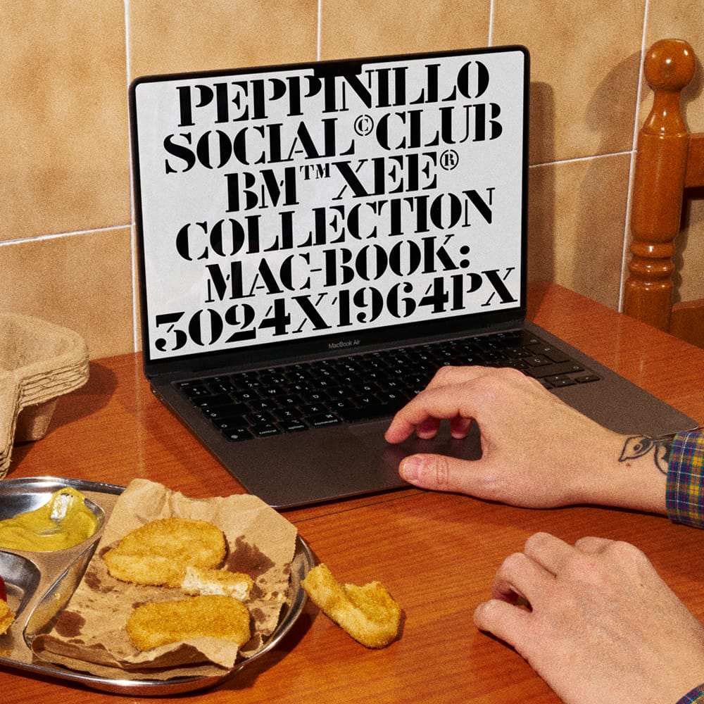 Free MacBook Screen Mockup on Wooden Dining Table PSD